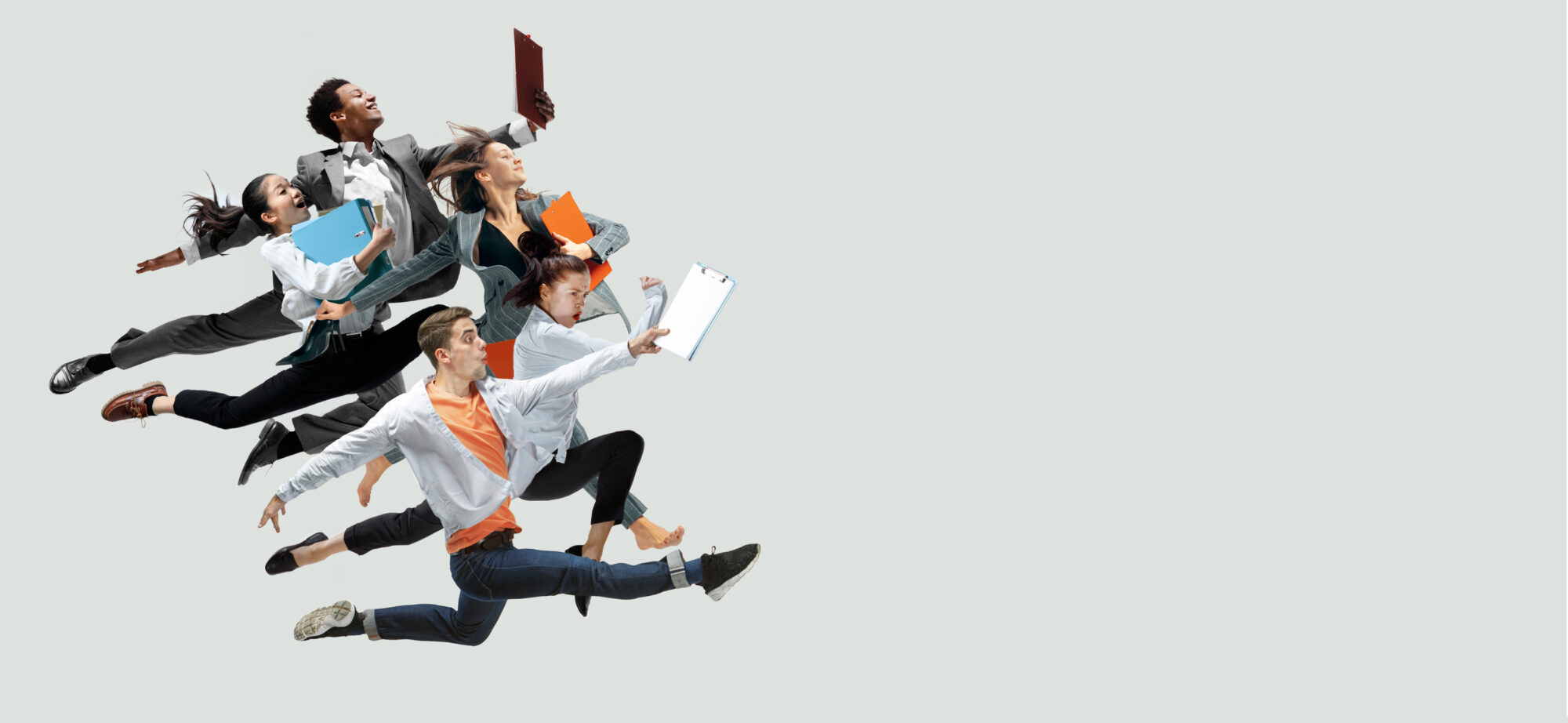 Office workers jumping isolated on studio background